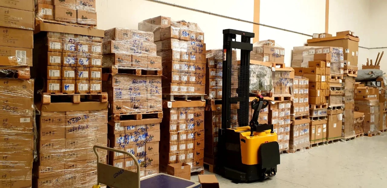Palletised Samsung stock and warehouse stacker inside the Gizo facility