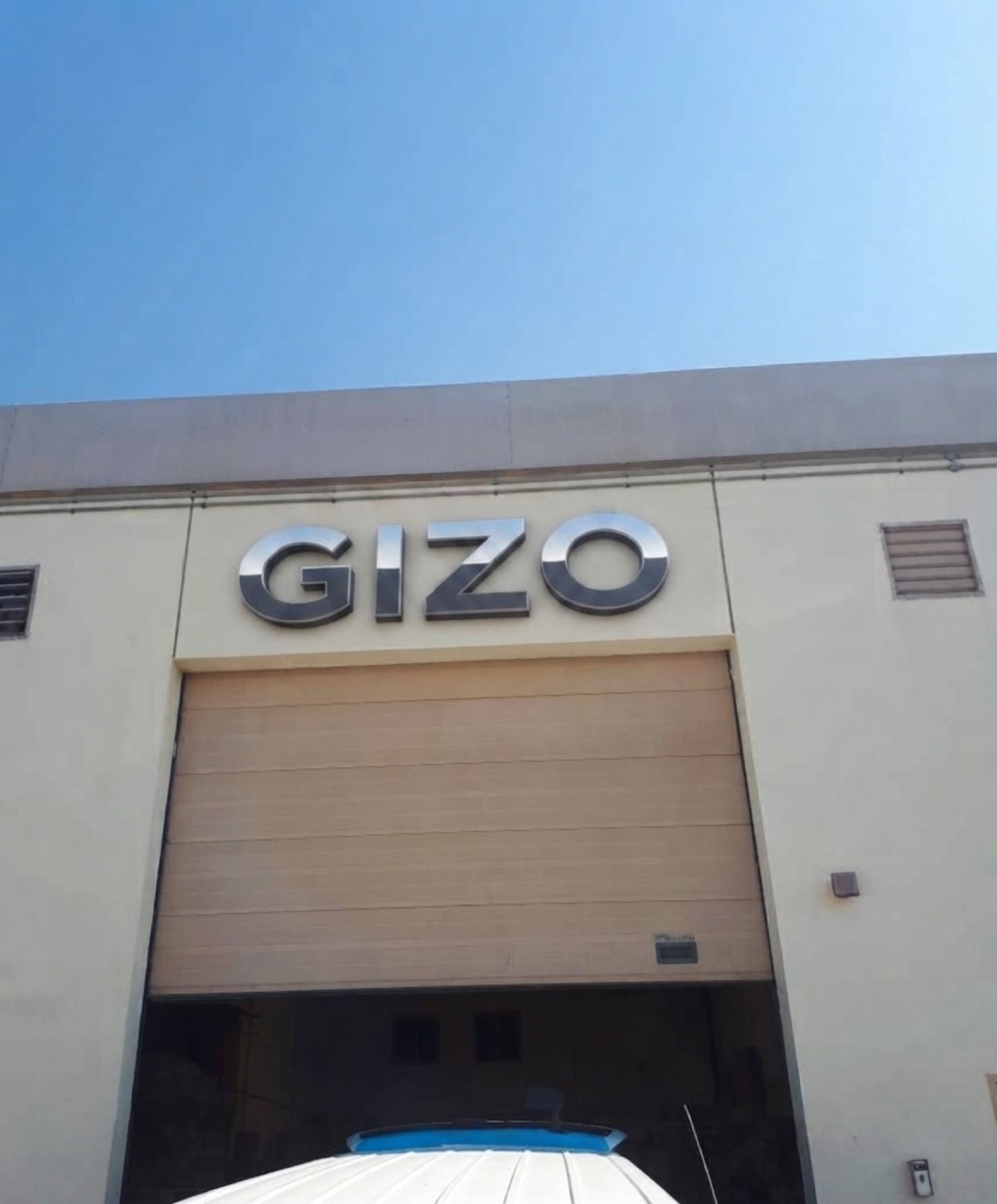 Gizo branded warehouse exterior with loading bay